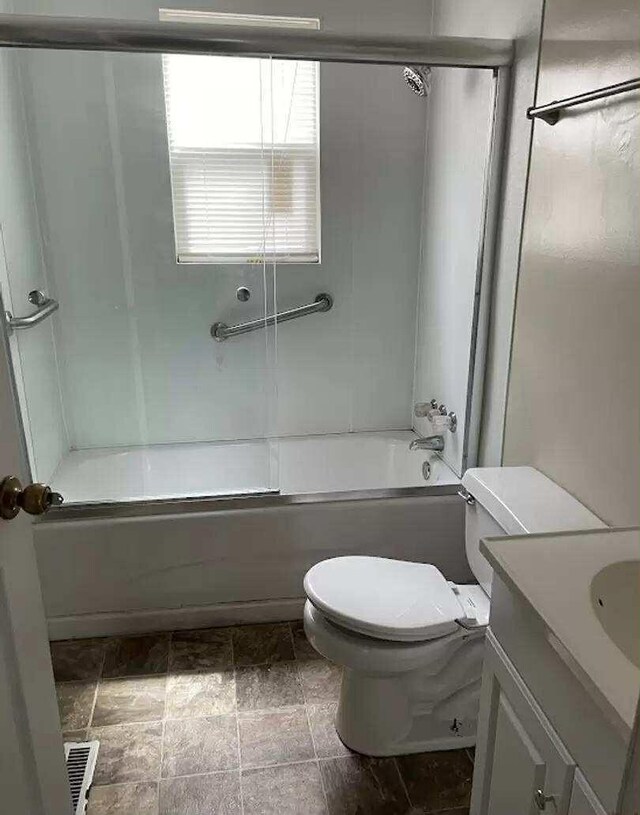 4922 Marylin Ln, Chattanooga, TN 37411 - bathroom featuring shower / bath combination with glass door, toilet, and vanity
