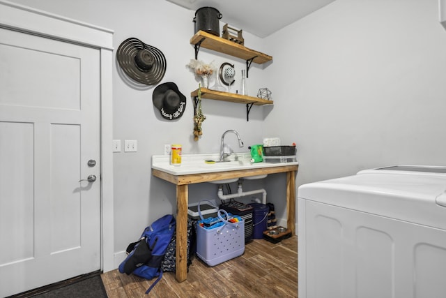 laundry area with washing machine and clothes dryer, laundry area, and dark wood finished floors