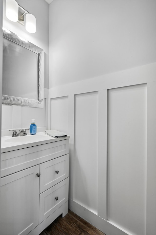 bathroom featuring wood finished floors and vanity