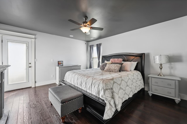 bedroom featuring dark wood-style flooring, baseboards, and a ceiling fan
