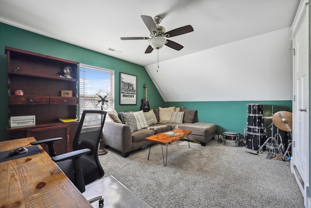 office area featuring visible vents, a ceiling fan, carpet flooring, and lofted ceiling