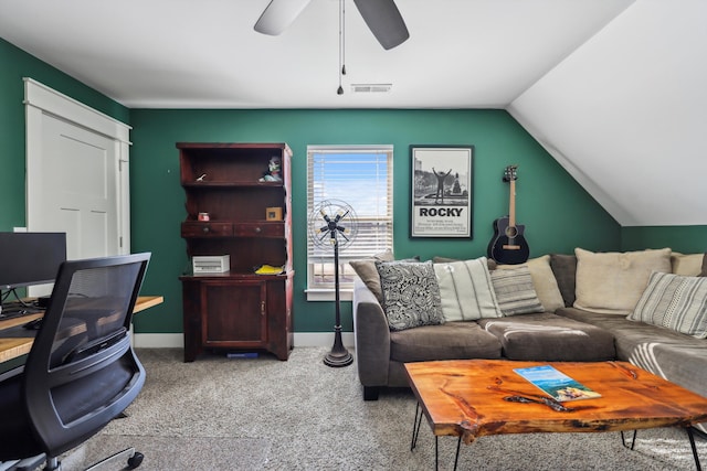 interior space featuring visible vents, baseboards, a ceiling fan, vaulted ceiling, and carpet flooring