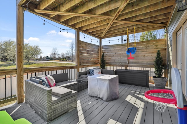 wooden deck featuring an outdoor hangout area