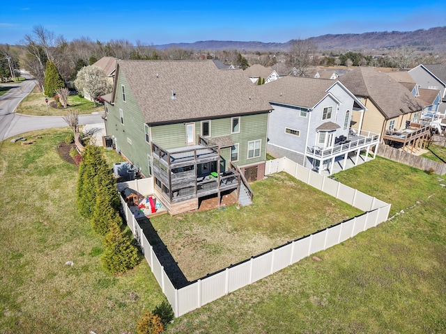 aerial view featuring a mountain view and a residential view