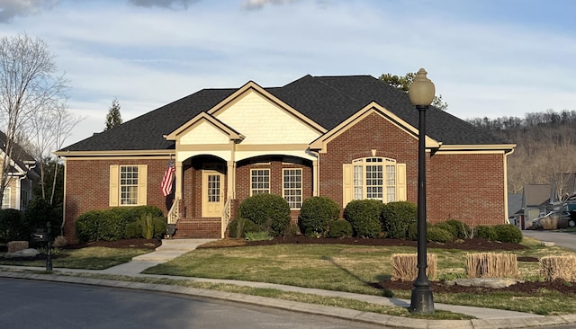 1760 Holden Farm Pl, Ooltewah, TN 37363 - view of front of property featuring brick siding, a front lawn, and roof with shingles