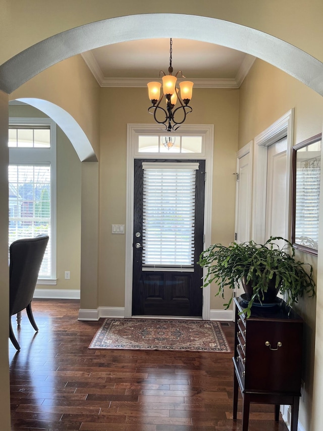 1760 Holden Farm Pl, Ooltewah, TN 37363 - entryway with dark wood finished floors, arched walkways, crown molding, baseboards, and a chandelier