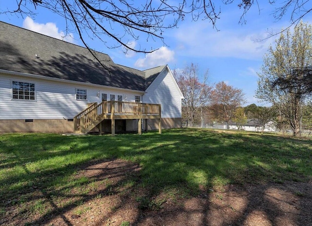 back of house with a lawn, crawl space, a wooden deck, and stairway
