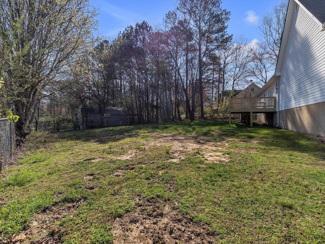 view of yard with a wooden deck