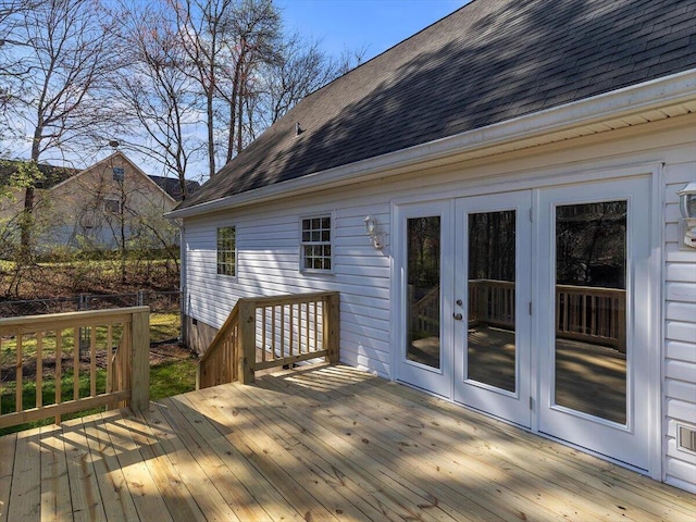 wooden deck featuring french doors