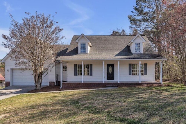 view of front facade featuring an attached garage, a front lawn, concrete driveway, and a porch