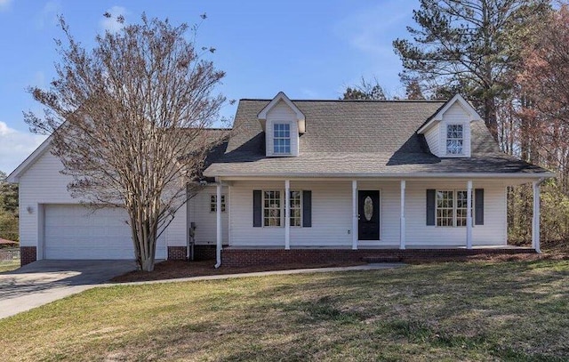 view of front facade with a front lawn, driveway, an attached garage, and a porch