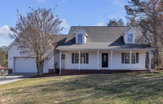 cape cod-style house featuring driveway, covered porch, a garage, and a front lawn