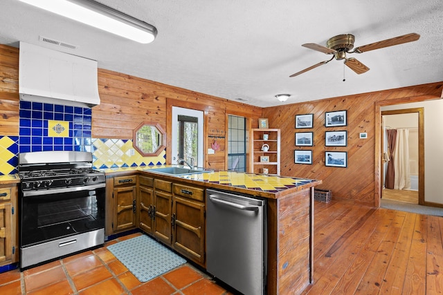 2345 County Rd 865, Gaylesville, AL 35973 - kitchen with backsplash, ceiling fan, appliances with stainless steel finishes, a peninsula, and a sink