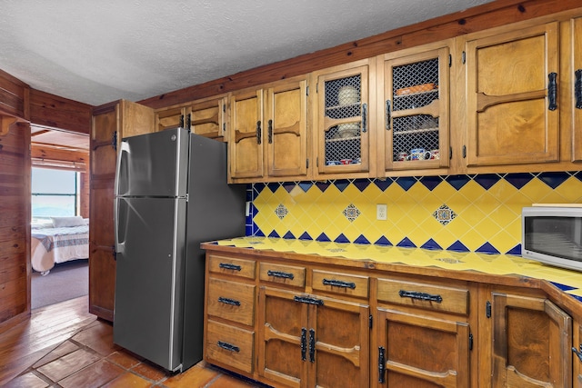 2345 County Rd 865, Gaylesville, AL 35973 - kitchen featuring a textured ceiling, stainless steel appliances, tasteful backsplash, and light countertops