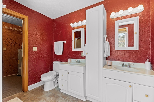 2345 County Rd 865, Gaylesville, AL 35973 - bathroom featuring toilet, a textured ceiling, water heater, vanity, and a textured wall