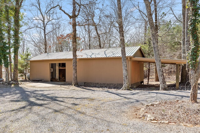 2345 County Rd 865, Gaylesville, AL 35973 - exterior space featuring an attached carport, metal roof, and gravel driveway