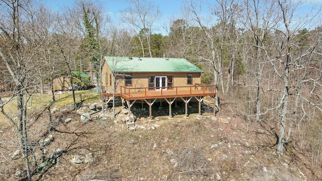 2345 County Rd 865, Gaylesville, AL 35973 - rear view of house featuring a wooden deck, metal roof, and a wooded view