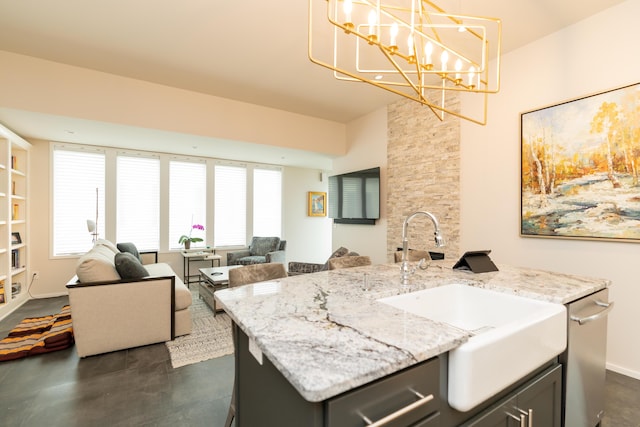 295 W 19th St, Chattanooga, TN 37408 - kitchen with light stone countertops, a sink, open floor plan, pendant lighting, and an inviting chandelier