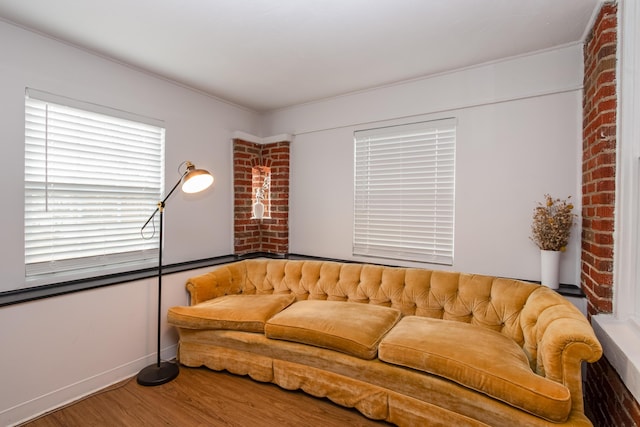 living room featuring baseboards and wood finished floors