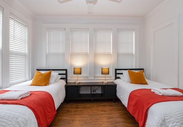 bedroom featuring crown molding, ceiling fan, and wood finished floors