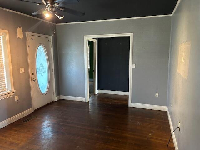 foyer featuring ceiling fan, baseboards, wood finished floors, and crown molding