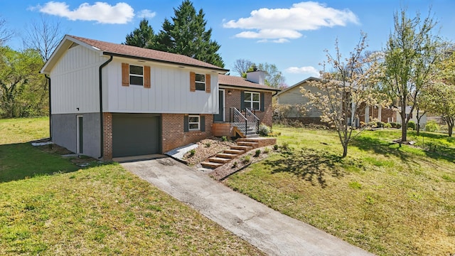 split level home with an attached garage, aphalt driveway, a front lawn, brick siding, and a chimney
