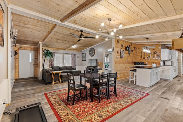 105 Massingale Rd, Tellico Plains, TN 37385 - dining area with wooden ceiling, beamed ceiling, wood walls, ceiling fan with notable chandelier, and light wood-type flooring