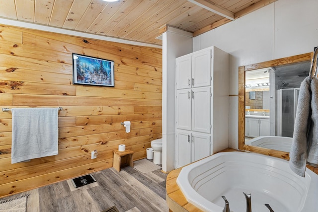 105 Massingale Rd, Tellico Plains, TN 37385 - full bath featuring a shower stall, a bath, toilet, wood ceiling, and wood finished floors