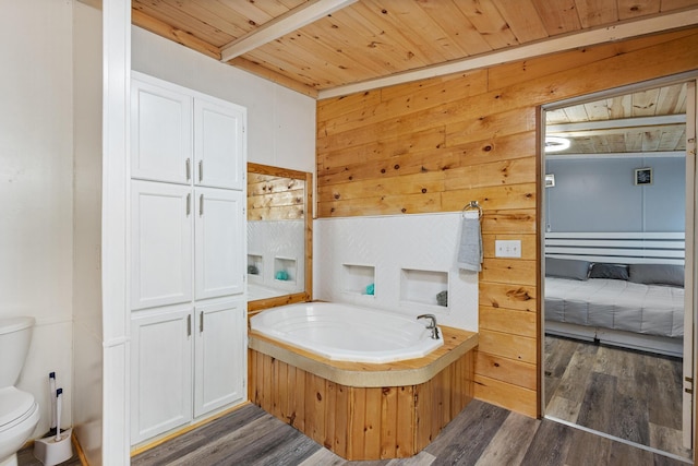 105 Massingale Rd, Tellico Plains, TN 37385 - bathroom with wooden ceiling, toilet, wooden walls, a garden tub, and wood finished floors