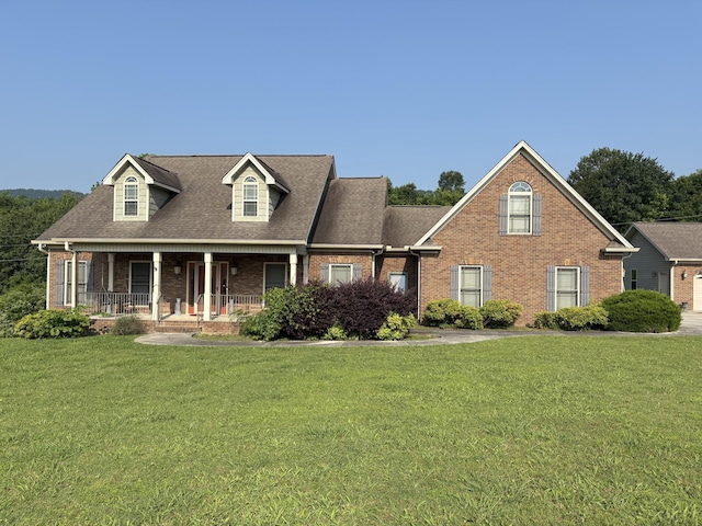104 Mountain View Dr, Flintstone, GA 30725 - cape cod house featuring brick siding, covered porch, a front lawn, and a shingled roof