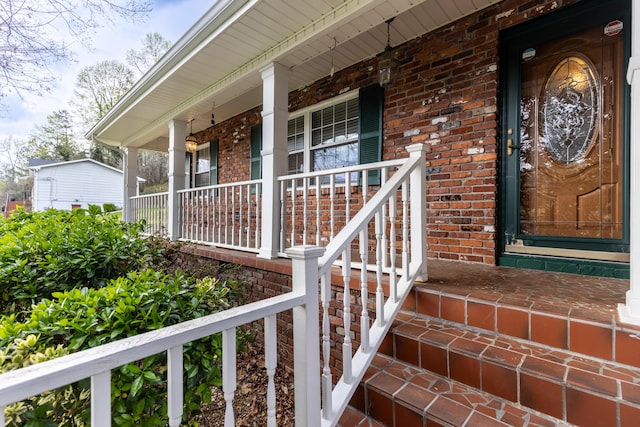 7004 Lystra Rd, Harrison, TN 37341 - doorway to property with covered porch and brick siding