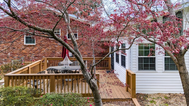 7004 Lystra Rd, Harrison, TN 37341 - rear view of property with a wooden deck and brick siding
