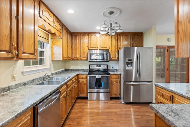 7004 Lystra Rd, Harrison, TN 37341 - kitchen with appliances with stainless steel finishes, brown cabinets, and recessed lighting
