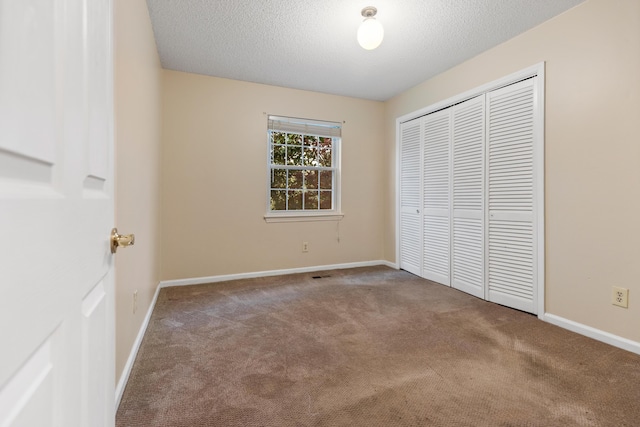 7004 Lystra Rd, Harrison, TN 37341 - unfurnished bedroom with carpet flooring, a textured ceiling, and a closet