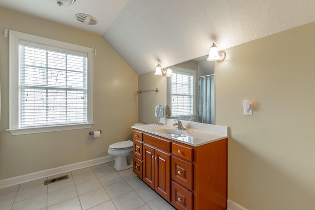 bathroom featuring baseboards, vaulted ceiling, visible vents, and tile patterned flooring