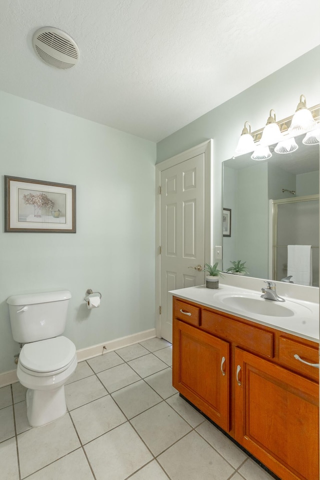 full bathroom with a shower stall, toilet, tile patterned floors, baseboards, and visible vents