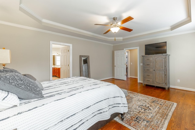 bedroom with wood finished floors and crown molding