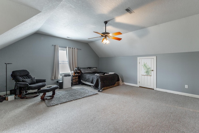 bedroom featuring lofted ceiling, baseboards, and carpet floors
