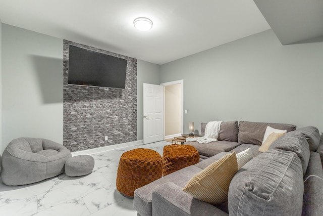 living room featuring marble finish floor and baseboards