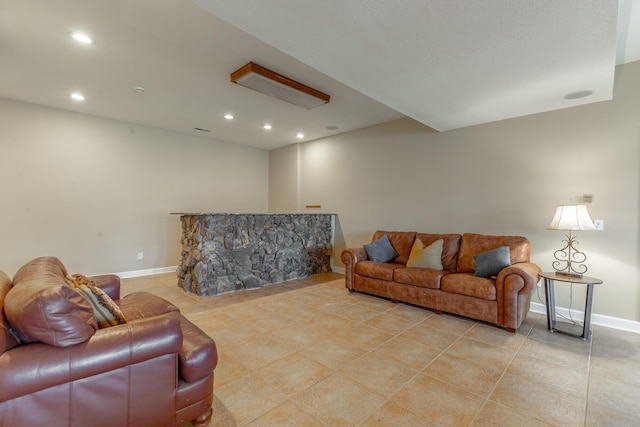 living area featuring baseboards, light tile patterned flooring, and recessed lighting