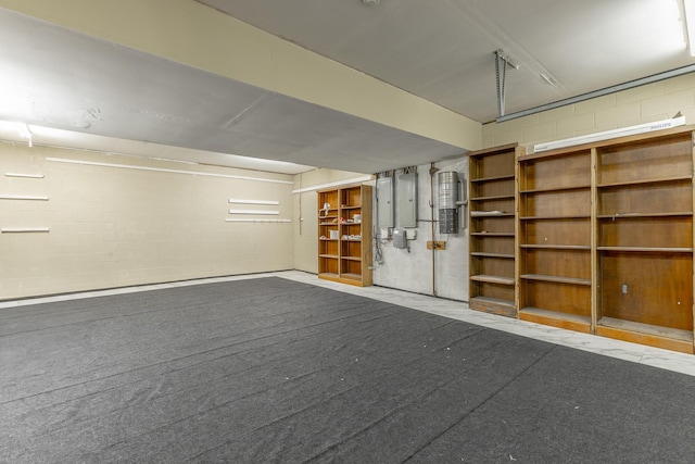 garage with concrete block wall