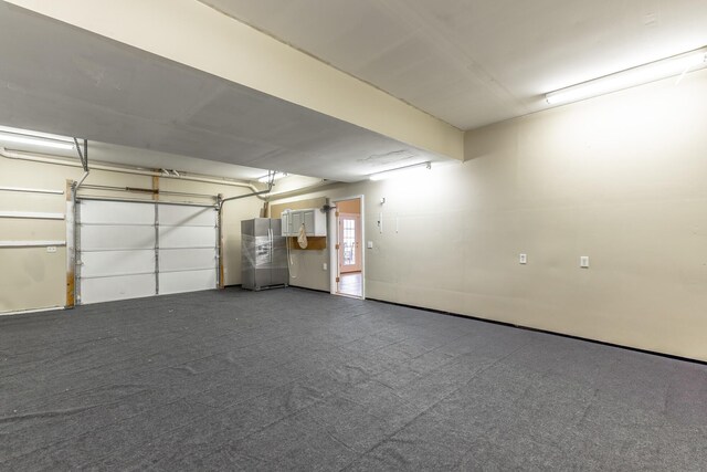 garage featuring freestanding refrigerator