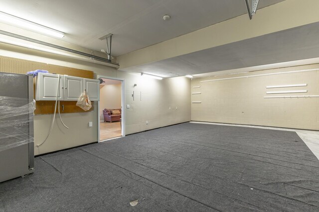 garage with concrete block wall