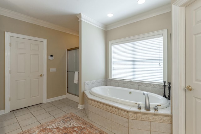 bathroom featuring a garden tub, crown molding, a stall shower, baseboards, and tile patterned flooring