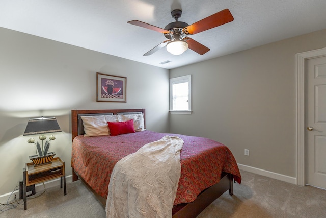 bedroom with visible vents, baseboards, a ceiling fan, and carpet flooring