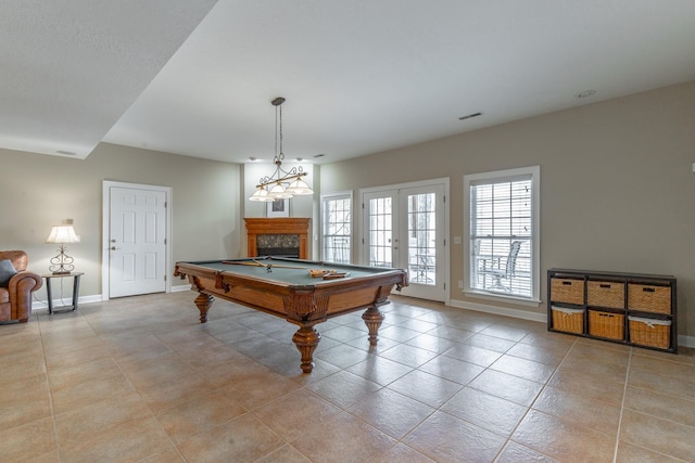 recreation room featuring visible vents, light tile patterned flooring, pool table, baseboards, and a fireplace