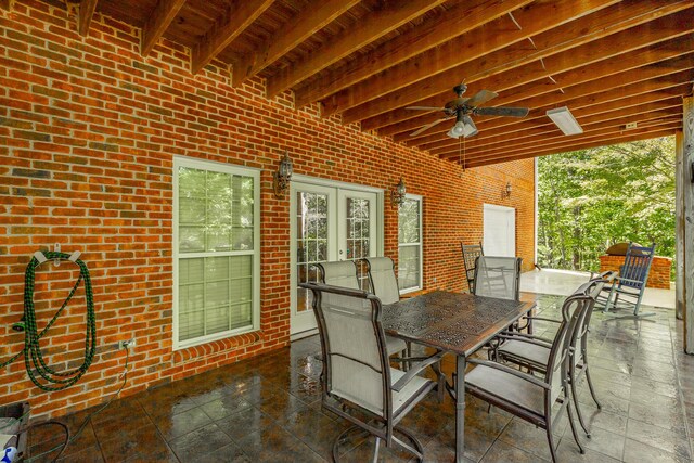 view of patio / terrace with a ceiling fan and outdoor dining area