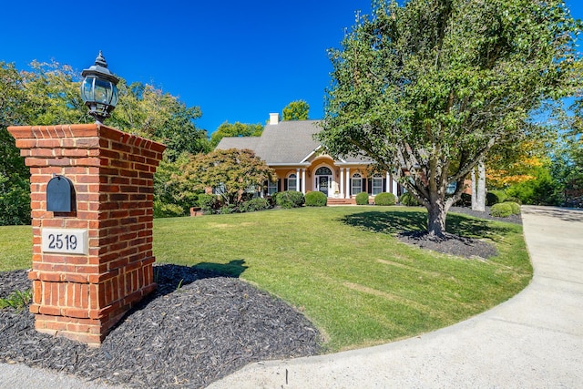 view of front of home with a front yard