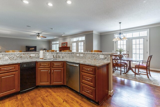 kitchen featuring stainless steel dishwasher, a sink, brown cabinets, dark wood-type flooring, and ornamental molding