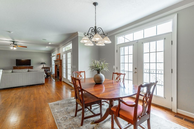 dining area featuring french doors, visible vents, and a wealth of natural light
